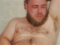 The gay pigs piss just sprays out of his hairy cock straight into his face